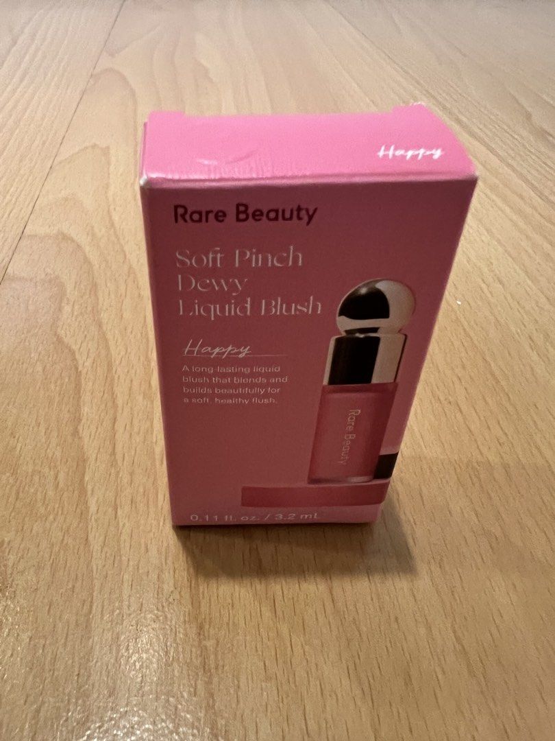 Rare Beauty Liquid Blush in Happy (Category: Makeup) located in Manila. Submitted by piperpenn (Listing ID 1468852997, Image 3). Description: - Product: Rare Beauty Soft Pinch Dewy Liquid Blush - Shade: Happy - Size: Mini size (3.2 ml) - Finish: Dewy with a long-lasting, easily blendable formula - Condition: Brand new, never opened, in original packaging.