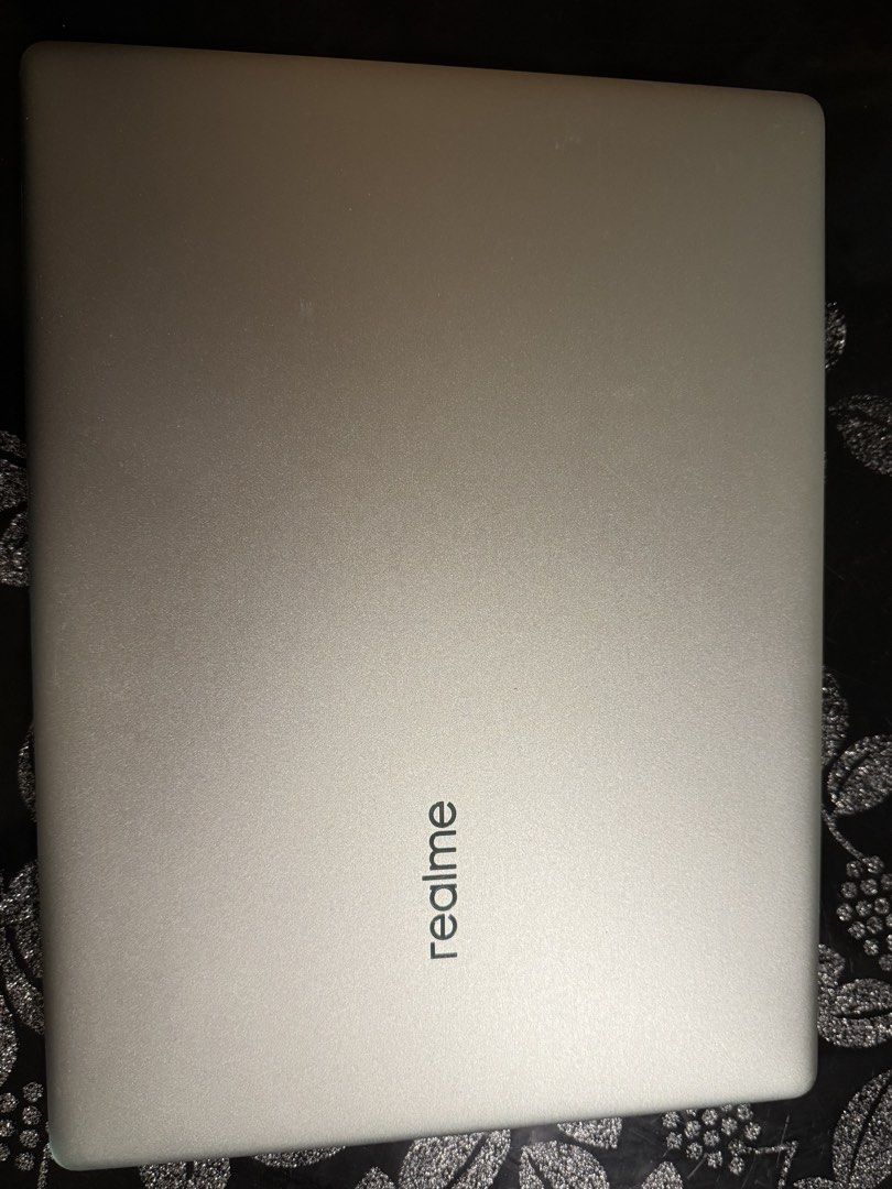 Realme Book Intel Core i5 Laptop (Category: Laptops & Notebooks) located in Rizal. Submitted by velle.yzo (Listing ID 1468778899, Image 1). Description: - Realme laptop in silver finish. - Intel Core i5 processor with Iris Xe graphics inside. - DTS audio support. - Compact keyboard layout with trackpad below. - Bottom vents and rubber feet intact. - Clean silver lid with embossed realme logo. Bought this for school po and well used ko na siya. So