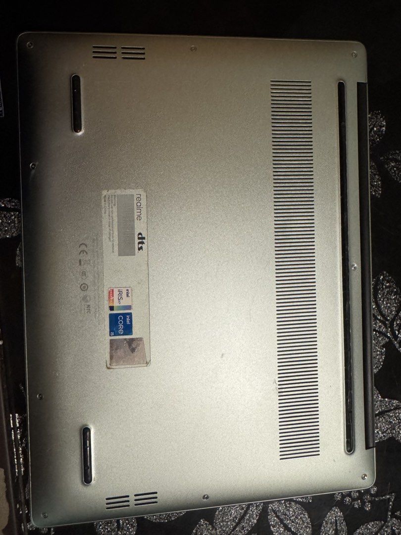 Realme Book Intel Core i5 Laptop (Category: Laptops & Notebooks) located in Rizal. Submitted by velle.yzo (Listing ID 1468778899, Image 2). Description: - Realme laptop in silver finish. - Intel Core i5 processor with Iris Xe graphics inside. - DTS audio support. - Compact keyboard layout with trackpad below. - Bottom vents and rubber feet intact. - Clean silver lid with embossed realme logo. Bought this for school po and well used ko na siya. So