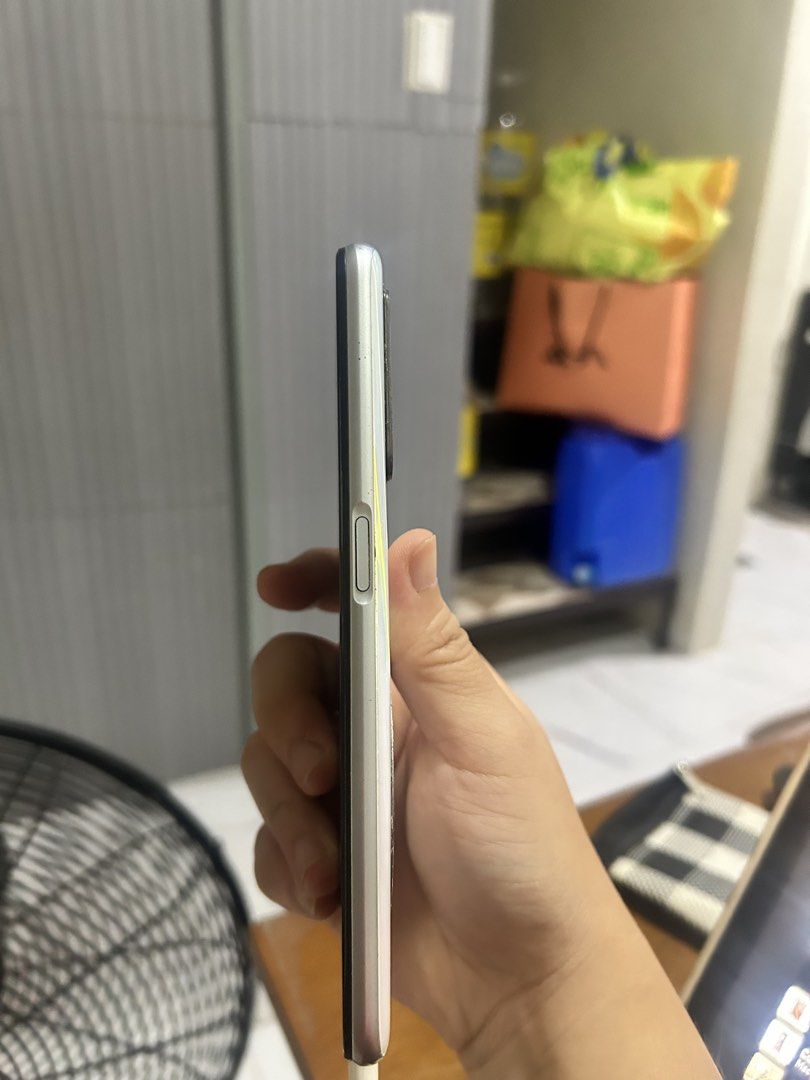 RealMe Gaming Phone (Category: Android Others) located in Manila. Submitted by mihos.garage.sale (Listing ID 1468717805, Image 3). Description: - Brand/Model: Realme RMX2001 - Storage: 128GB internal storage / 4GB RAM - OS: Android 11 with Realme UI v2.0 - Processor: Octa-core - Color: White with sleek design - Condition: Pre-loved, well-maintained -With a steiagh multicolored display line - Delivery options: Meetup at Southville 1, Brgy. Marinig