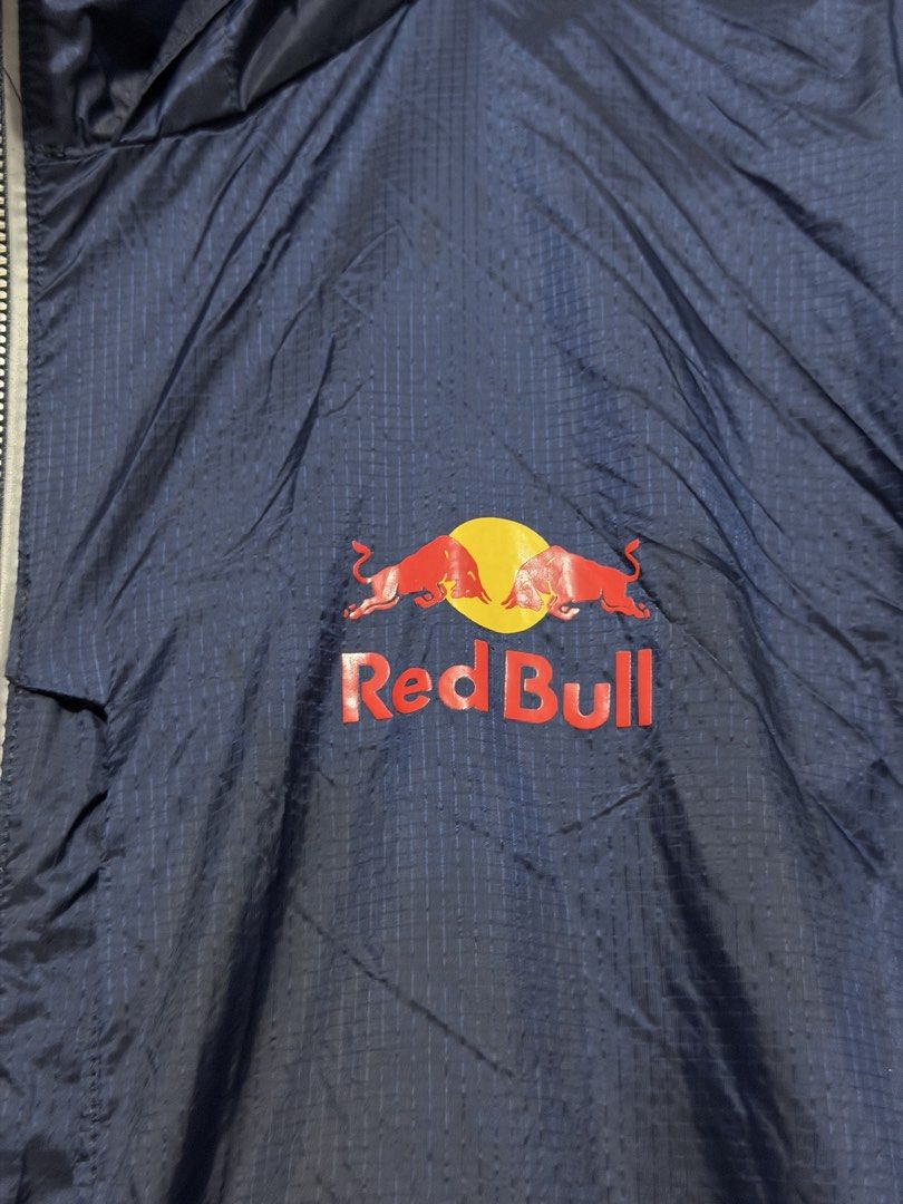 Red Bull Windbreaker Jacket (Category: Coats, Jackets and Outerwear) located in Calumpit. Submitted by Essentiality (Listing ID 1468861627, Image 2). Description: Red Bull Windbreaker Jacket 24x28 L on tag.