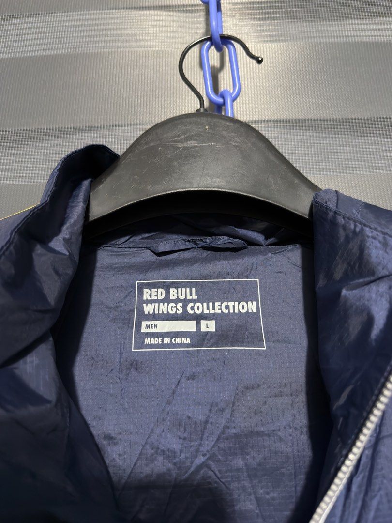 Red Bull Windbreaker Jacket (Category: Coats, Jackets and Outerwear) located in Calumpit. Submitted by Essentiality (Listing ID 1468861627, Image 3). Description: Red Bull Windbreaker Jacket 24x28 L on tag.