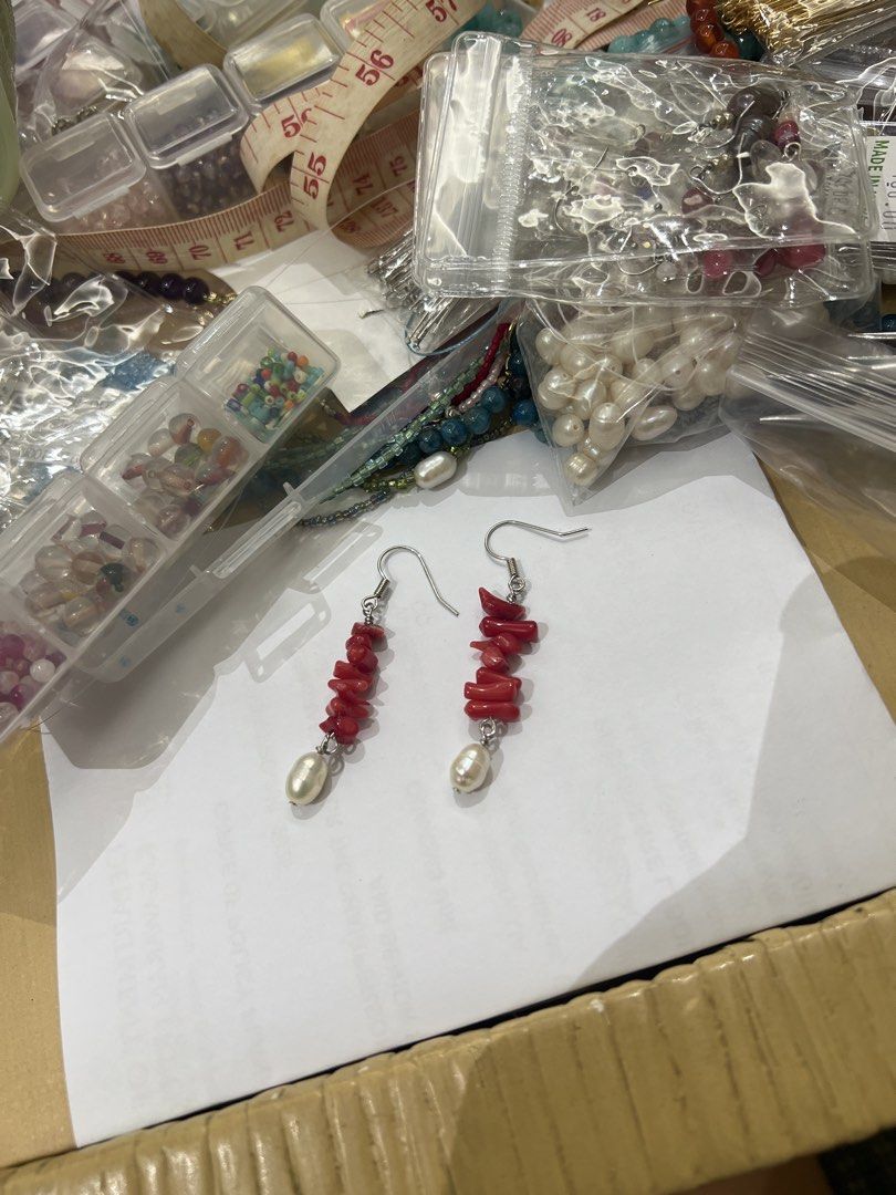 Red coral and white pearl dangle earrings (Category: Earrings) located in Quezon City. Submitted by iminquezoncity (Listing ID 1468847603, Image 1). Description: - Handmade dangle earrings featuring natural red coral chips - Finished with an elegant white freshwater pearl drop at the bottom - Secured with comfortable silver-toned fishhook wires - Lightweight design perfect for everyday wear or dressing up for special occasions.