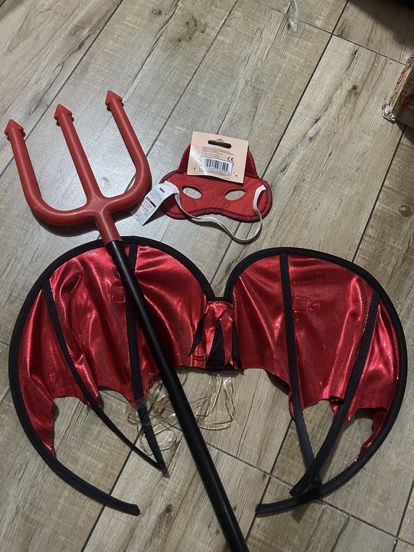 Red Devil Demon Costume Set Wings Trident Horns Mask (Category: Sets & Coordinates) located in Paranaque City. Submitted by zac.sei (Listing ID 1468898043, Image 2). Description: - Complete kids' devil costume set - Includes red wings, red trident prop, black ram horns headband, and a sparkly red sequin eye mask - Ideal for Halloween parties and dress-up events - Kids sizing indicated on packaging - Stored together and ready for your next event.