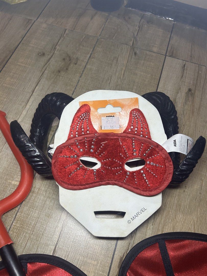 Red Devil Demon Costume Set Wings Trident Horns Mask (Category: Sets & Coordinates) located in Paranaque City. Submitted by zac.sei (Listing ID 1468898043, Image 3). Description: - Complete kids' devil costume set - Includes red wings, red trident prop, black ram horns headband, and a sparkly red sequin eye mask - Ideal for Halloween parties and dress-up events - Kids sizing indicated on packaging - Stored together and ready for your next event.