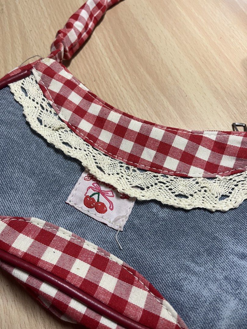 Red gingham and denim shoulder bag (Category: Shoulder Bags) located in Antipolo. Submitted by nominnnm (Listing ID 1468795483, Image 3). Description: Coquette gingham kili bag New. Never nagamit rfs: naka tambak lang sa bahay.