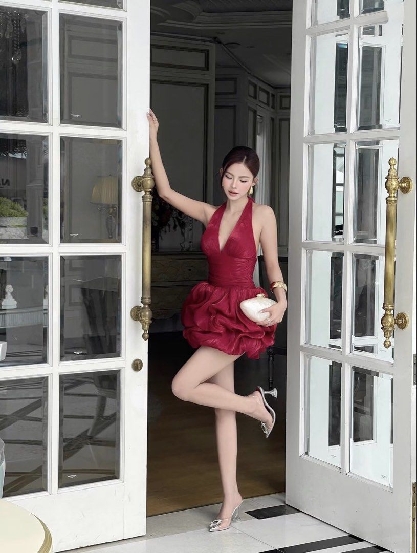 Red Halter Neck Bubble Mini Dress (rent) (Category: Dresses) located in Manila. Submitted by ayzelll (Listing ID 1468842078, Image 2). Description: - Color: Deep red - Style: Halter neck mini dress with plunging neckline and backless design - Details: Ruched bodice, voluminous bubble skirt, and ruffled hem - Fit: Slim through the top - Condition: Worn once for a photoshoot, in great shape.