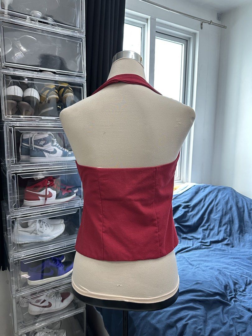 Red Halter Neck Peplum Crop Top (Category: Sleeveless) located in Quezon City. Submitted by valeriorac74670 (Listing ID 1468815765, Image 2). Description: - Color: Deep red - Style: Halter neck with structured V-neckline and open back - Fit: Slim through the torso with a flared hem past the waist - Details: Button-up front closure and clean stitching - Material: Thick, durable cotton-blend.