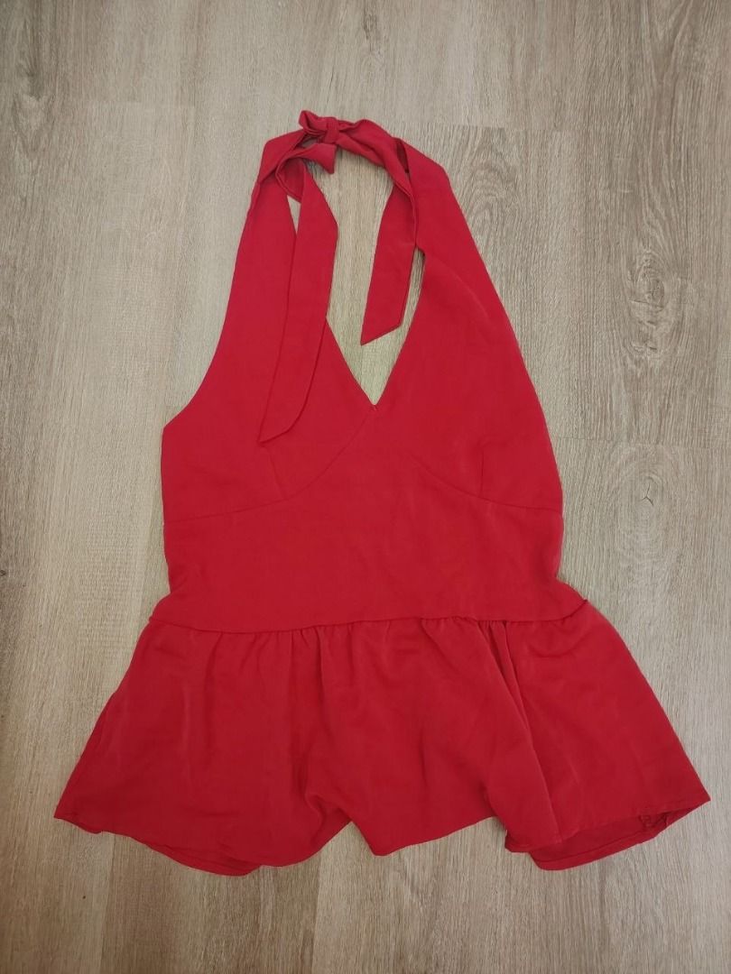 Red Halter Neck Peplum Top with Tie Back (Category: Sleeveless) located in Manila. Submitted by babeboxtheory (Listing ID 1468859594, Image 3). Description: - Color: Bright red - Style: Halter top with V-neck and structured under-bust seams - Fit: Stretchy smocked back panel and cute tie-back - Details: Flared, flowy peplum hem - Fabric: Lightweight and comfortable - Perfect for: Casual day wear or dressing up for a night out with jeans or a skir