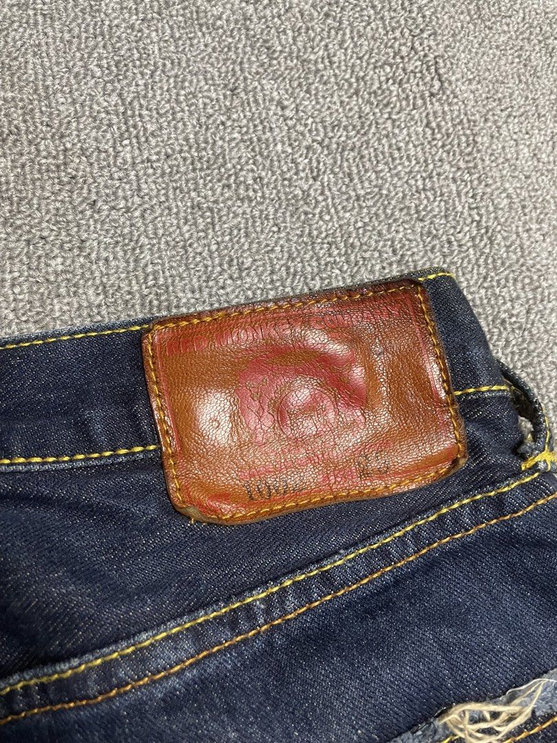 Red Monkey Company RMC Denim Jeans (Category: Jeans) located in Quezon City. Submitted by cozy_thrifting (Listing ID 1468739046, Image 3). Description: - Brand: Red Monkey Company - Material: 100% cotton raw indigo denim in dark wash - Closure: Button fly with branded copper rivets - Details: Detailed sunburst and pyramid pocket graphics with frayed edges - Features: Patterned inner pocket lining and leather back patch - Condition: Dark wash with