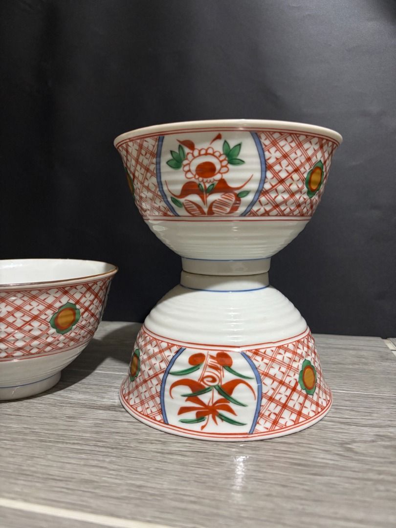 Red Oriental Bowls P75 each (Category: Dinnerware & Cutlery) located in Baao. Submitted by apr1979 (Listing ID 1468788503, Image 2). Description: - 4 pcs available. VGC. Signed - 6 x 3.4 inches - Traditional Japanese tableware design with red and blue floral patterns - Stackable to save cabinet space - Features a white exterior base with ribbed texture - Versatile size great for rice, soup, or side dishes.