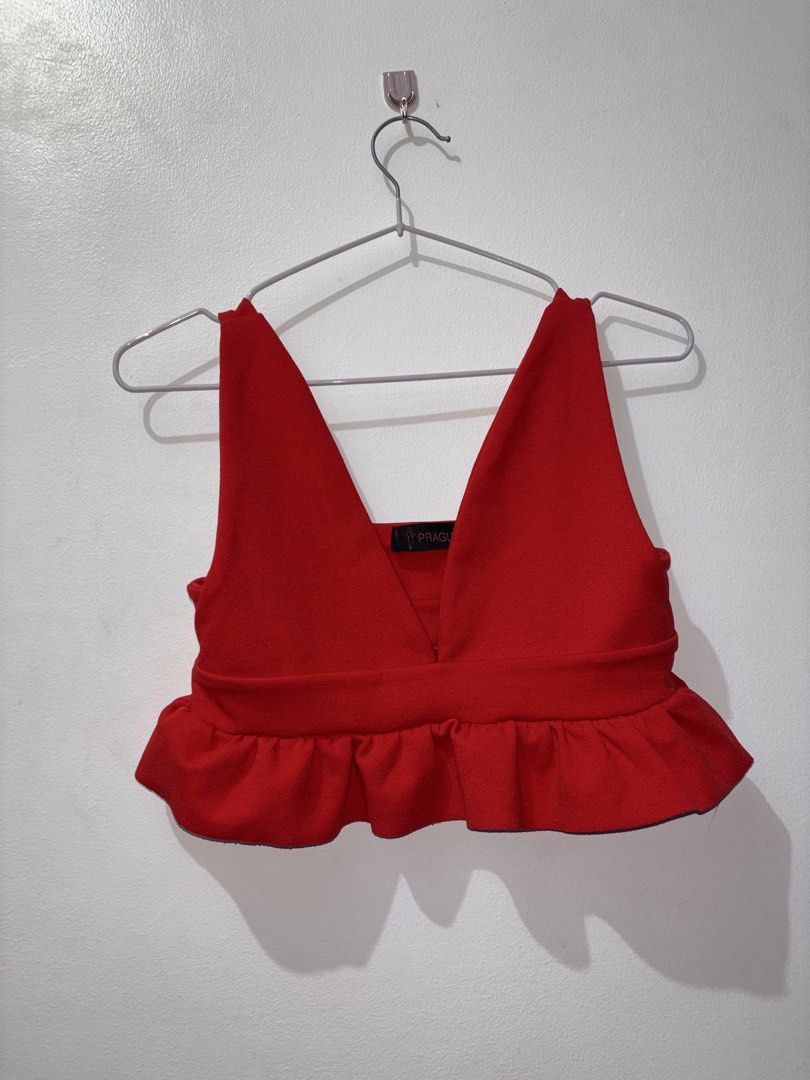 Red plunge peplum crop top (Category: Others Tops) located in Manila. Submitted by sophia_blessy (Listing ID 1468722759, Image 1). Description: A deep V-neckline, wide tank straps, a fitted banded waist, and a flared, ruffled peplum hemline..
