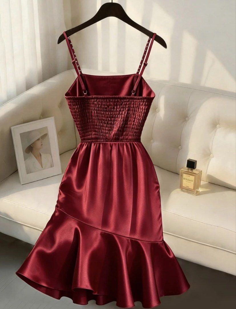 Red Satin Spaghetti Strap Mini Dress with Ruffle Hem (Category: Dresses) located in Caloocan City. Submitted by conanpearl (Listing ID 1468795709, Image 2). Description: - Color: Rich burgundy - Material: Smooth, glossy satin fabric with a flexible smocked back panel - Design: Elegant cowl neckline, beaded spaghetti straps, and a trendy layered ruffle skirt - Versatility: Ideal for parties, dinners, and nights out - Styling Tip: Easy to dress up 