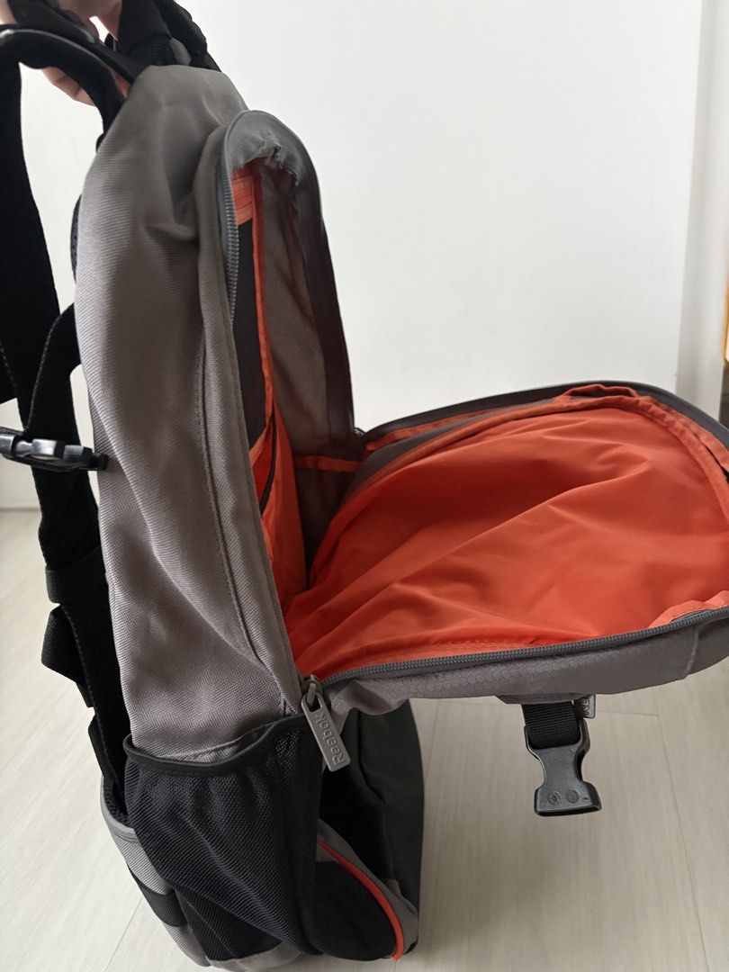 Reebok backpack (Category: Backpacks) located in Singapore. Submitted by baseinsg (Listing ID 1468802465, Image 5). Description: Selling a Reebok backpack. The backpack is good quality and provides good back support. Selling at $13. Collect at Blk 253, Bishan ST22, Postal 570253 or Bishan MRT. Stylish grey backpack with a unique orange geometric leaf design. - Convenient mesh side pockets for water bottles. - Comfortable padded shoulder straps fo