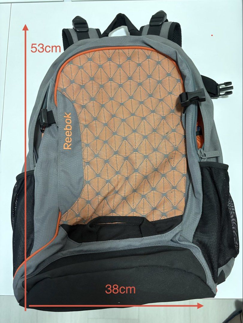Reebok backpack (Category: Backpacks) located in Singapore. Submitted by baseinsg (Listing ID 1468802465, Image 6). Description: Selling a Reebok backpack. The backpack is good quality and provides good back support. Selling at $13. Collect at Blk 253, Bishan ST22, Postal 570253 or Bishan MRT. Stylish grey backpack with a unique orange geometric leaf design. - Convenient mesh side pockets for water bottles. - Comfortable padded shoulder straps fo