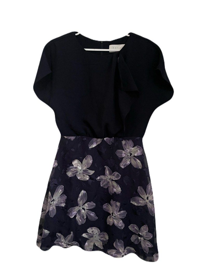 Navy Blue Floral Dress (Category: Dresses) located in Makati City. Submitted by nikarchives (Listing ID 1468749930, Image 1). Description: - Brand: REFILL (Made in Korea) - Design: Navy blue top with a purple floral pattern skirt - Details: Short cap sleeves, round neckline with a decorative shoulder button, and back zip closure - Care: Dry clean only - Style: Cute and versatile for casual outings or work.