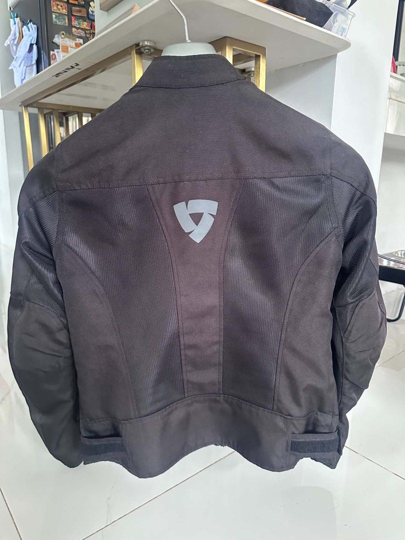 REV'IT! Black Mesh Motorcycle Riding Jacket (Category: Helmets and other Riding Gears) located in Cavite. Submitted by andre.29 (Listing ID 1468742546, Image 2). Description: - Brand/Model: REV'IT! black mesh motorcycle jacket - Condition: Excellent, clean with no scuffs or tears - Ventilation: Breathable mesh panels on chest and back for hot weather rides - Storage & Closure: Full zip front and zippered hand pockets - Fit & Adjustability: Adjust