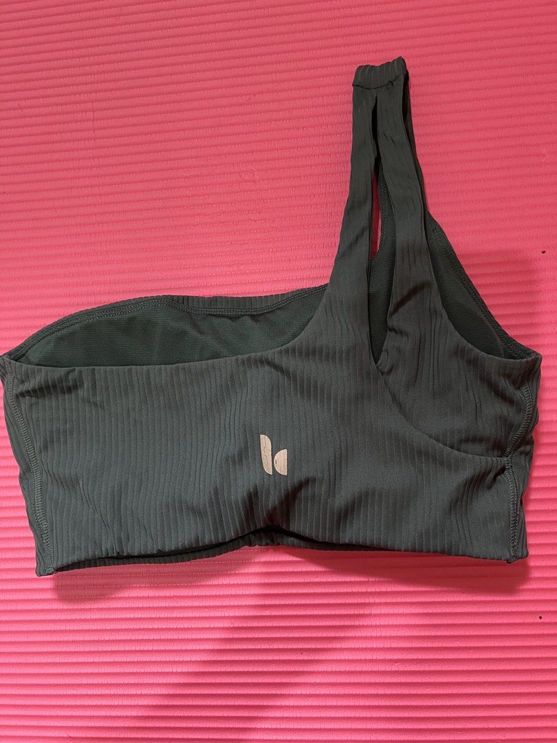 Ribbed One-Shoulder Sports Bra (Category: Activewear) located in Rizal. Submitted by s0apandglory (Listing ID 1468773474, Image 3). Description: - Color: like military green - Design: Trendy one-shoulder strap with a subtle logo near the bottom band - Padding: Includes removable pads - Material: Soft, stretchy, and comfortable fabric - Ideal for: Workouts, yoga, and everyday casual wear.