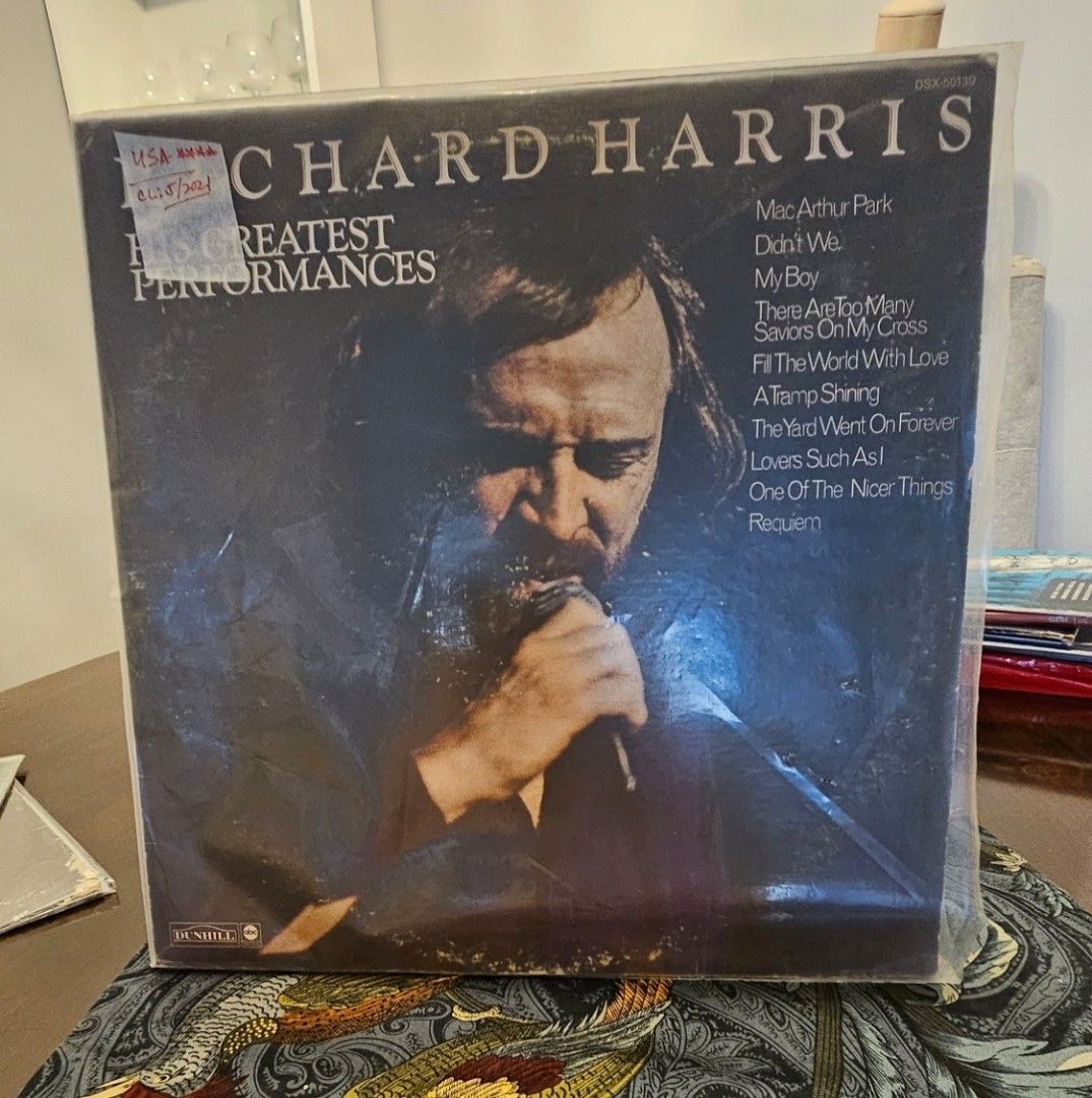 Richard Harris His Greatest Performances Vinyl LP Record (Category: Vinyls) located in Manila. Submitted by cosmicshark-cd31f1 (Listing ID 1468774971, Image 1). Description: - Artist & Title: Richard Harris Compilation LP - Label: Dunhill Records - Key Tracks: MacArthur Park, Didn't We, My Boy - Condition: Sleeve inside protective plastic outer cover with clear back tracklist - Genre: Classic 1970s traditional pop and spoken word.