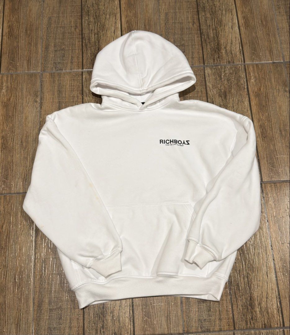 RICHBOYZ WHITE BASIC LOGO HOODIE (Category: Coats, Jackets and Outerwear) located in Manila. Submitted by urban-vintage_2 (Listing ID 1468857031, Image 1). Description: ISSUE: NONE (NEED WASH) MOP :GCASH (NO COD) SHIP VIA: LALAMOVE & J&T LOCATION: PASIG CITY LENGTH: 25 WIDTH : 23.