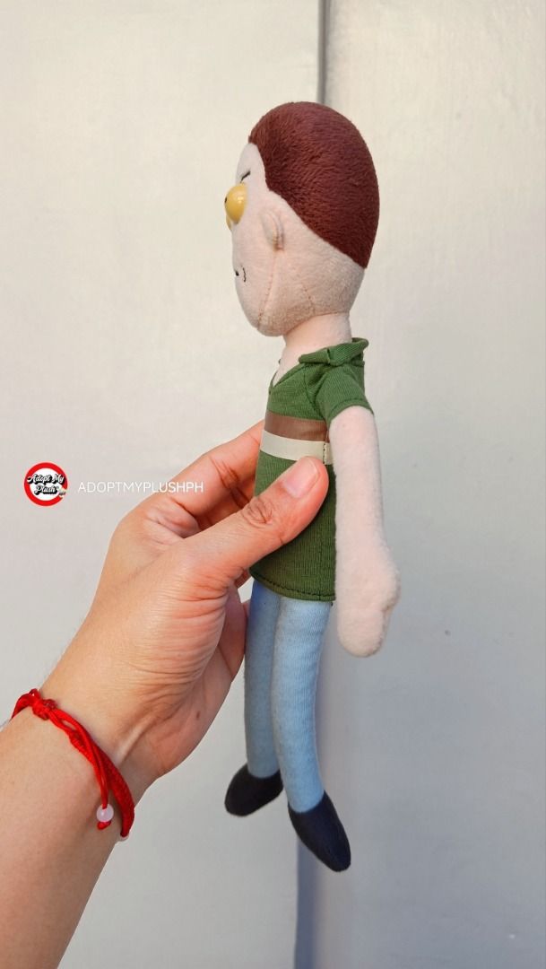 Rick and Morty, Gerald 'Jerry' Smith plush (Category: Plushies & Soft Toys) located in Taguig. Submitted by adopt.my.plush.ph (Listing ID 1468774928, Image 3). Description: Jerry is the husband of Beth Smith, the father of Summer Smith and Morty Smith, and the son-in-law of Rick Sanchez. Key Details & Features • Eyes: Features hard, 3D dome plastic eyes. As highlighted in the photo, these particular plastic elements are prone to notable yellowing