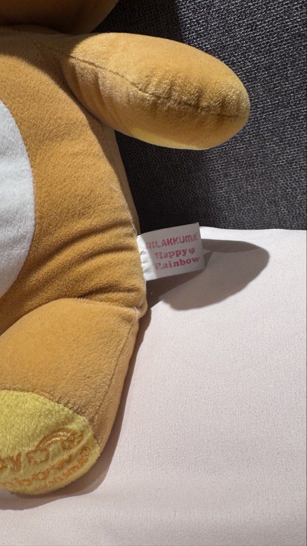 Rilakkuma Happy Rainbow Plush Doll (Category: Plushies & Soft Toys) located in Mandaluyong City. Submitted by maelovestoshop (Listing ID 1468875847, Image 2). Description: - Authentic Large Rilakkuma Happy Rainbow series plush toy - Super soft brown fur with white belly and yellow ear/foot accents - Features cute zipper-like embroidery detail down the back - Embroidered text on foot pad with original side tag attached - Pristine condition: clean 