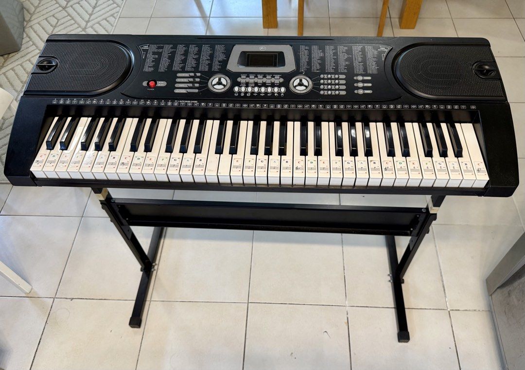 RJ Electronic Keyboard with Stand (Category: Musical Instruments) located in Pasig City. Submitted by alenatw (Listing ID 1468757914, Image 1). Description: RJ Tonemaster Keyboard Piano - Fully operational black electronic keyboard with built-in speakers and digital screen - Used but good condition, all keys 100% working. - Includes a sturdy metal X-stand - Full specifications in the last photo - Note sticker guides attached to the keys, perfect 