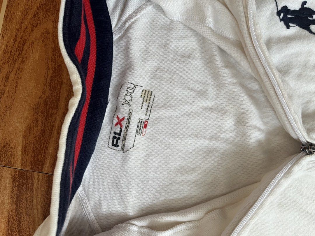 RLX Ralph Lauren Quarter Zip Pullover White (Category: Coats, Jackets and Outerwear) located in Manila. Submitted by stmngo (Listing ID 1468744903, Image 3). Description: Size 2xl on tag Width 25 inches Length 28 inches Need wash Minimal pinhole sa may neck line Good Condition 📍Manage your expectation. Item is thrifted. 📍Nagcarlan, Laguna.