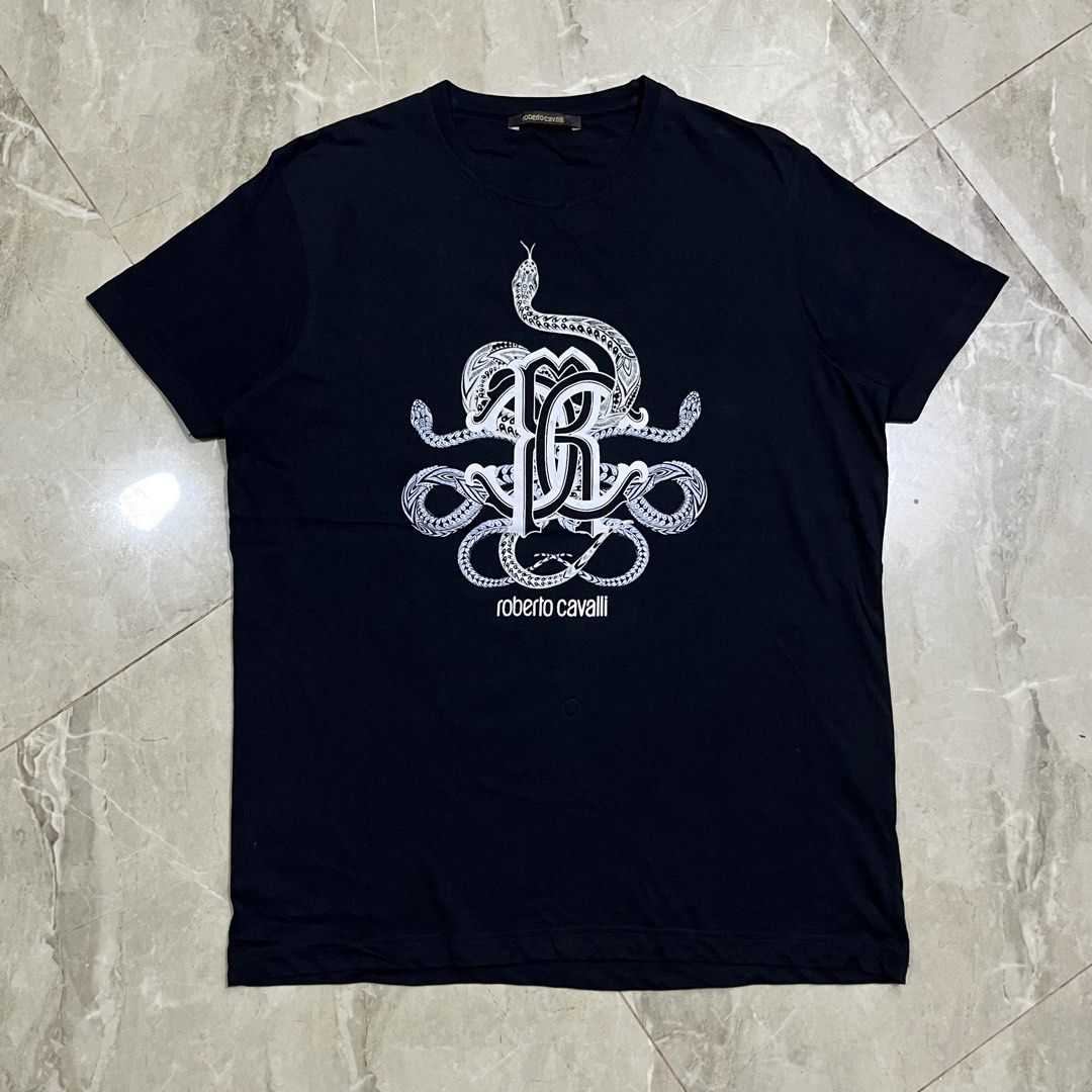 ROBERTO CAVALLI BLACK TSHIRT (Category: Luxury Apparel) located in Marikina City. Submitted by arniejane23 (Listing ID 1468881418, Image 1). Description: ROBERTO CAVALLI BLACK TSHIRT SIZE L ON TAG DIMENSION width - 21.5 length - 27.5 NO ISSUE/NO FLAWS EXCELLENT LIKE NEW CONDITION!! 📩📩📩 .