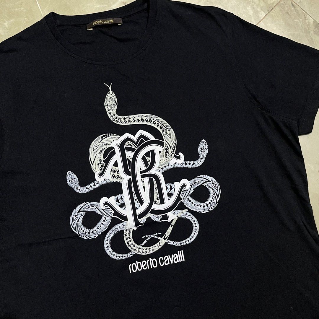 ROBERTO CAVALLI BLACK TSHIRT (Category: Luxury Apparel) located in Marikina City. Submitted by arniejane23 (Listing ID 1468881418, Image 2). Description: ROBERTO CAVALLI BLACK TSHIRT SIZE L ON TAG DIMENSION width - 21.5 length - 27.5 NO ISSUE/NO FLAWS EXCELLENT LIKE NEW CONDITION!! 📩📩📩 .
