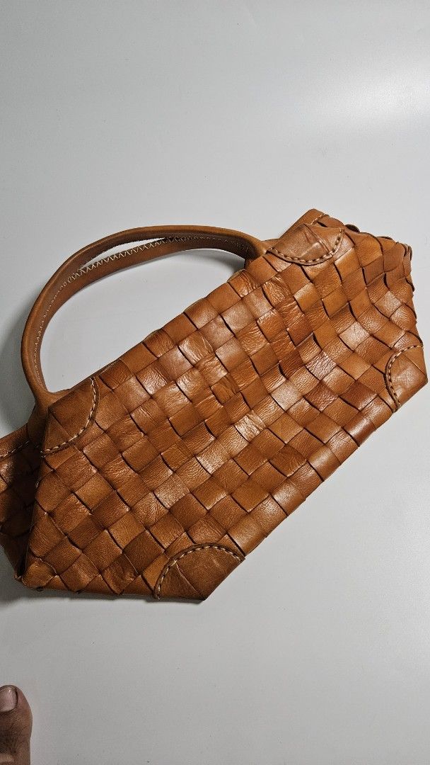 Robita Woven Leather Handbag Brown (Category: Shoulder Bags) located in Alfonso. Submitted by jbcamet (Listing ID 1468885095, Image 3). Description: - Brand: Robita - Material: Tan brown genuine leather with intricate all-over woven pattern - Style: Medium-sized bohemian everyday handbag - Handles: Double carrying handles with stitched detailing - Interior: Brown fabric lining with custom brand monogram pattern - Closure & Pockets: Secure magneti