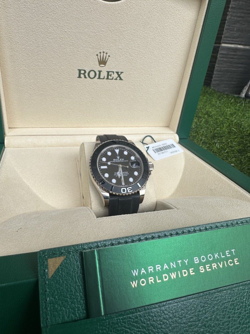 Rolex Yacht-Master 42 White Gold Black Rubber Watch M226659-0002 (Category: Watches) located in Singapore. Submitted by kaka.ong (Listing ID 1468744297, Image 2). Description: - Model: Rolex Yacht-Master 42 in 18k white gold - Dial: Black dial with round hour markers and 3 o'clock date window - Bezel: Rotating bezel with raised numerals - Strap: Black rubber Oysterflex strap with folding clasp - Includes: Green box, warranty booklet, hang tag, an