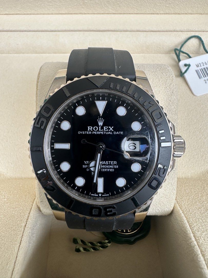 Rolex Yacht-Master 42 White Gold Black Rubber Watch M226659-0002 (Category: Watches) located in Singapore. Submitted by kaka.ong (Listing ID 1468744297, Image 1). Description: - Model: Rolex Yacht-Master 42 in 18k white gold - Dial: Black dial with round hour markers and 3 o'clock date window - Bezel: Rotating bezel with raised numerals - Strap: Black rubber Oysterflex strap with folding clasp - Includes: Green box, warranty booklet, hang tag, an