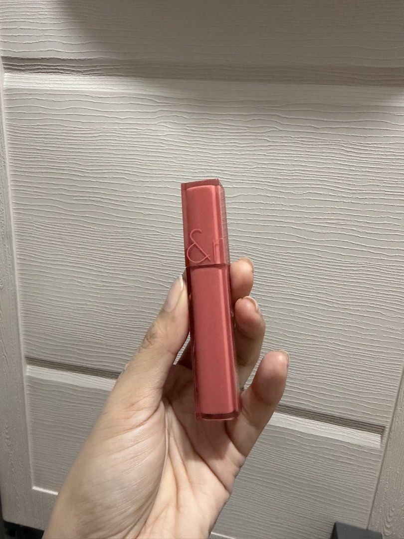 Rom&nd Dewy Water Tint (Category: Makeup) located in Davao. Submitted by fabdeclutter (Listing ID 1468925532, Image 2). Description: - Brand: Rom&nd Dewy Water Tint - Shade: Pretty pink - Finish: Glossy, long-lasting, and non-sticky - Texture: Super lightweight on lips - Condition: Clean, well-kept tube - Source: Bought from a local beauty store - Reason for selling: Decluttering makeup stash.