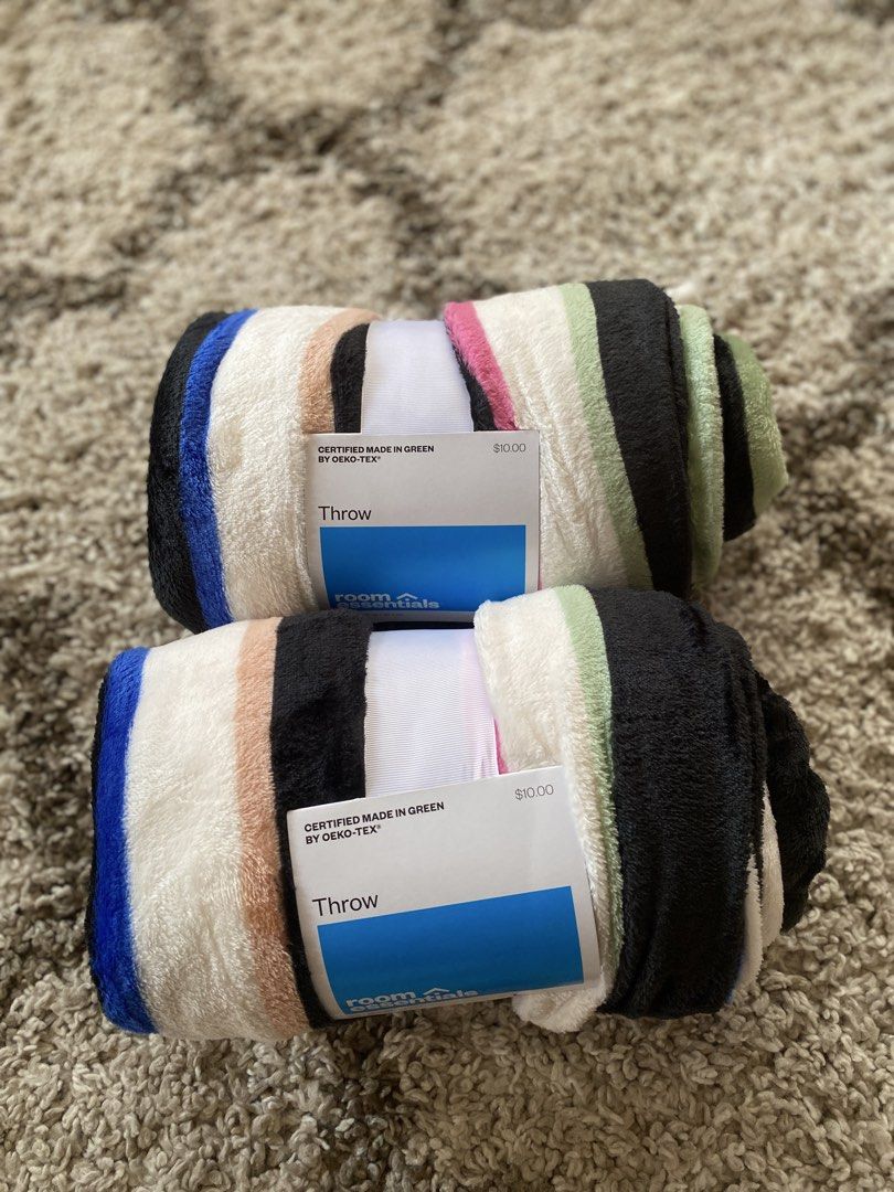 Room Essentials Rolled Throw Blanket Oeko-Tex Certified (Category: Bedding & Towels) located in Batangas. Submitted by lux_kimmy (Listing ID 1468840335, Image 2). Description: Room Essentials rolled throw blankets - Brand new with original store tags still attached - Material: 100% recycled polyester (eco-friendly) - Design: Stylish striped pattern in black, white, blue, green, and pink - Easy care: Machine washable on a normal cycle - Certified 
