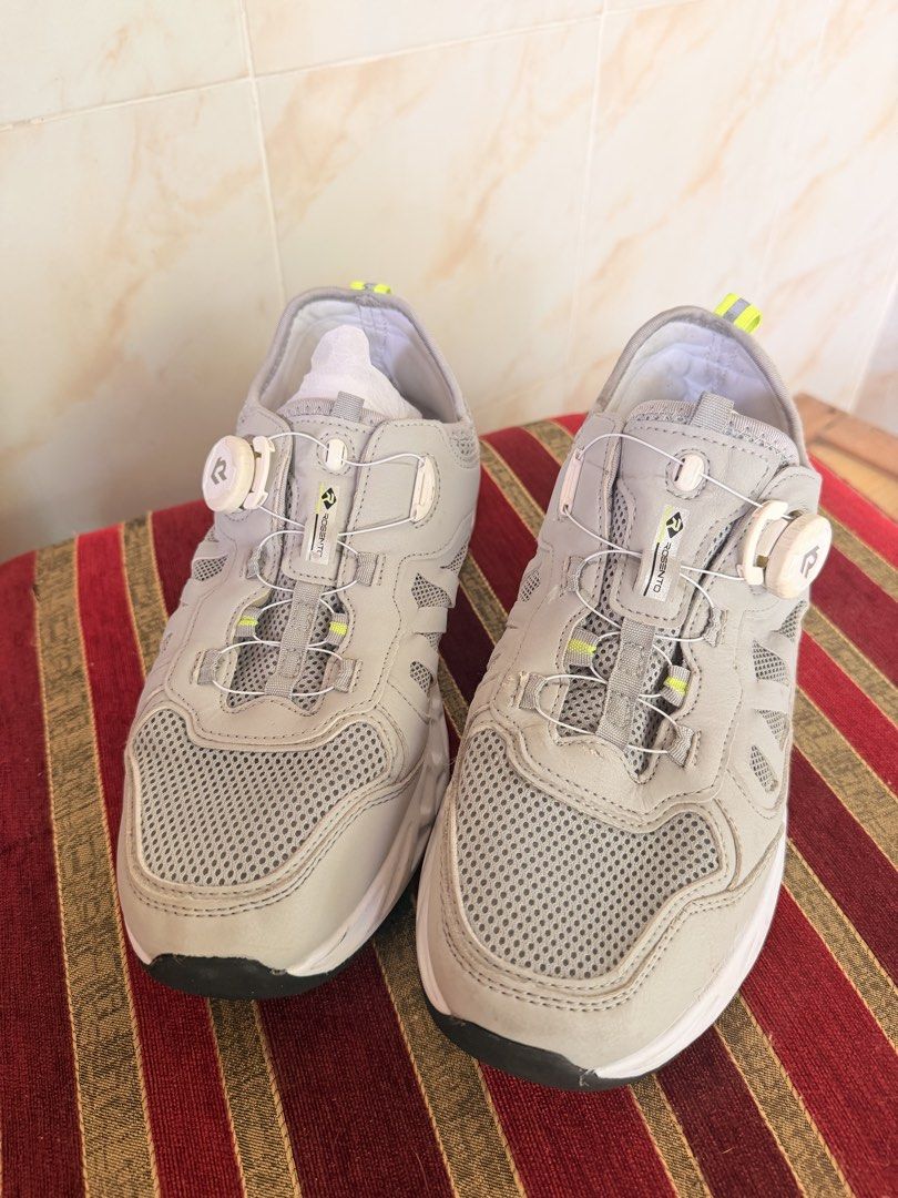 Rosento Grey Athletic Sneakers with Dial Lacing System (Category: Sneakers) located in Manila. Submitted by sedpuprincess (Listing ID 1468784211, Image 2). Description: - Brand: Rosento - Color: Grey with neon yellow accents - Upper: Breathable mesh - Lacing: Innovative dial lacing system (no traditional laces) - Soles: Chunky white soles with dark tread pattern - Condition: Brand new with clean interiors and packing paper intact.