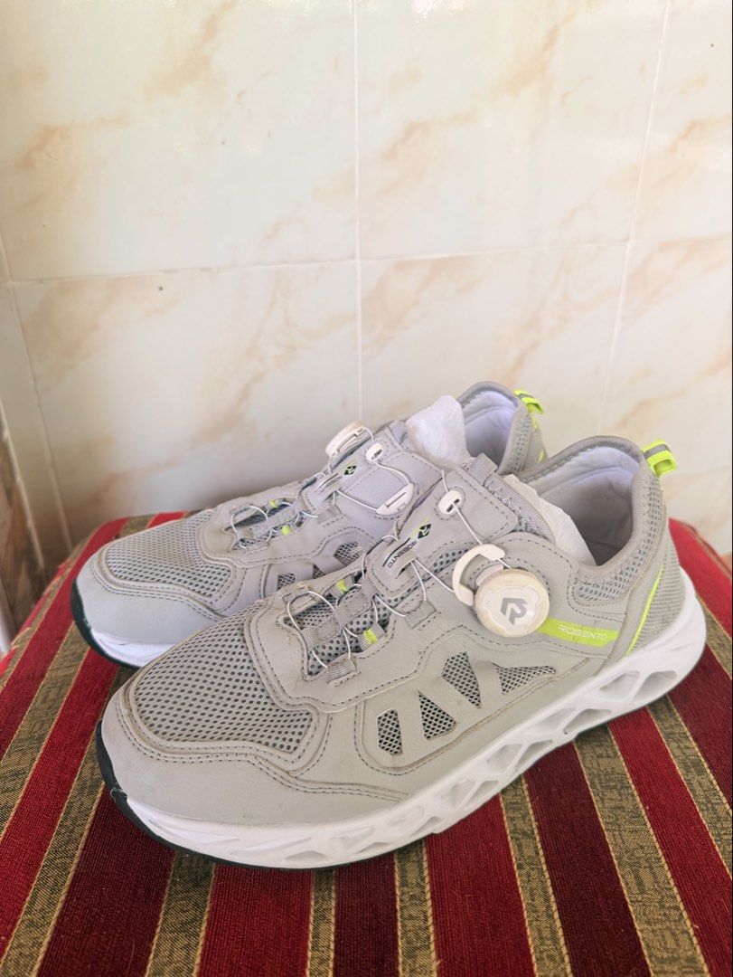 Rosento Grey Athletic Sneakers with Dial Lacing System (Category: Sneakers) located in Manila. Submitted by sedpuprincess (Listing ID 1468784211, Image 1). Description: - Brand: Rosento - Color: Grey with neon yellow accents - Upper: Breathable mesh - Lacing: Innovative dial lacing system (no traditional laces) - Soles: Chunky white soles with dark tread pattern - Condition: Brand new with clean interiors and packing paper intact.