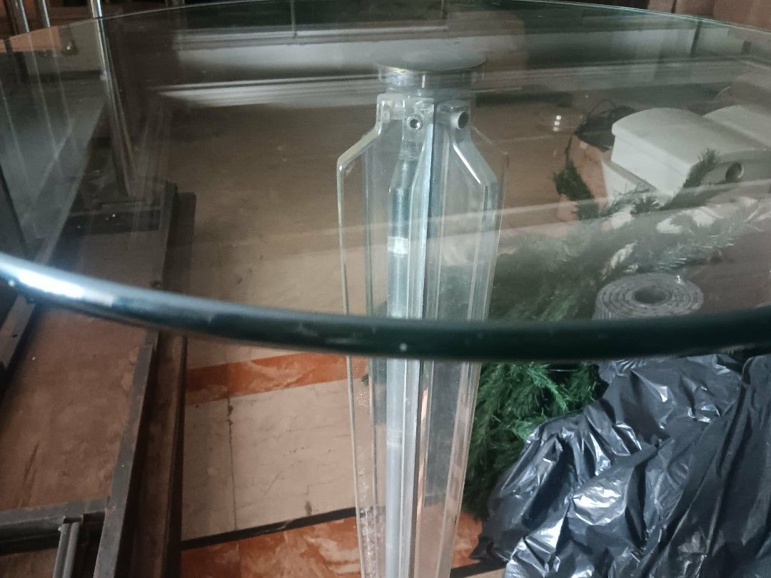Round glass top accent table with clear column base (Category: Tables & Sets) located in Las Pinas. Submitted by jesus1smysavi0r (Listing ID 1468745074, Image 2). Description: - Round glass top table with unique clear acrylic and metal support - Sturdy chrome-finished base for stability - Compact footprint, ideal for corners and tight spaces - Great for casual dining nooks or corner displays - Easy to wipe clean (note: minor smudge marks from sto