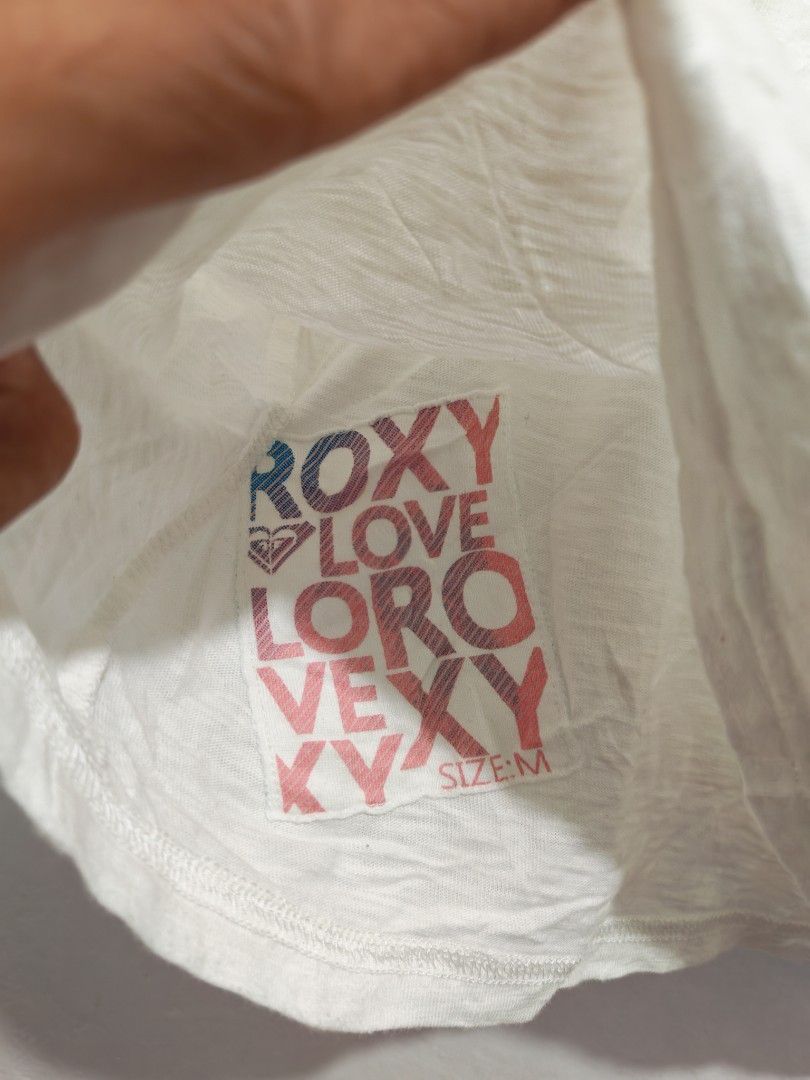 ROXY FOR HER (Category: Shirts) located in Pili. Submitted by janrypalmerodelima (Listing ID 1468882983, Image 3). Description: ROXY TOPS FOR HER DIMES: 17.5x20.5 CONDITION: EXCELLENT COLOR RATE: 10/10 ISSUE: NONE NEED WASH ONLY.