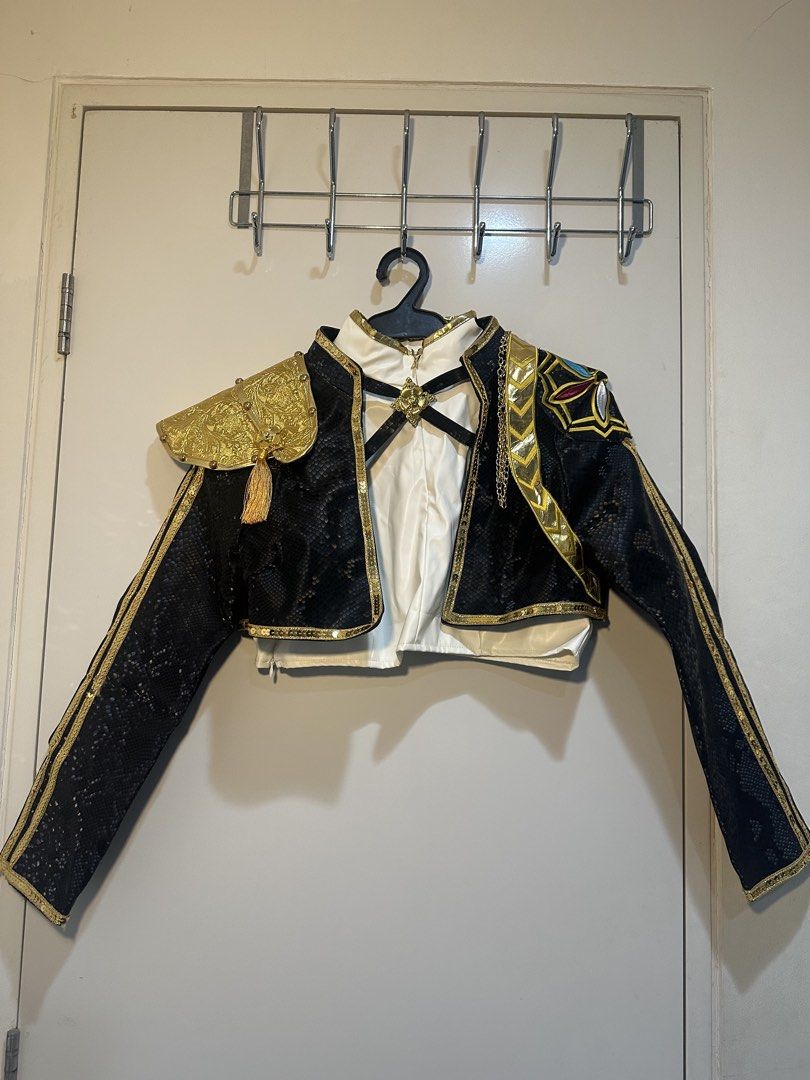 Rumi Jacket and Top Costume (Category: Coats, Jackets and Outerwear) located in Taguig. Submitted by ellajanee (Listing ID 1468786570, Image 1). Description: - Eye-catching black snakeskin texture short jacket with luxurious gold trim - Features an ornate gold shoulder epaulet with tassel details and metal chain accents - Designed with a smooth white satin inner layer and stylish front strap details - Back showcases a full textured pattern with a