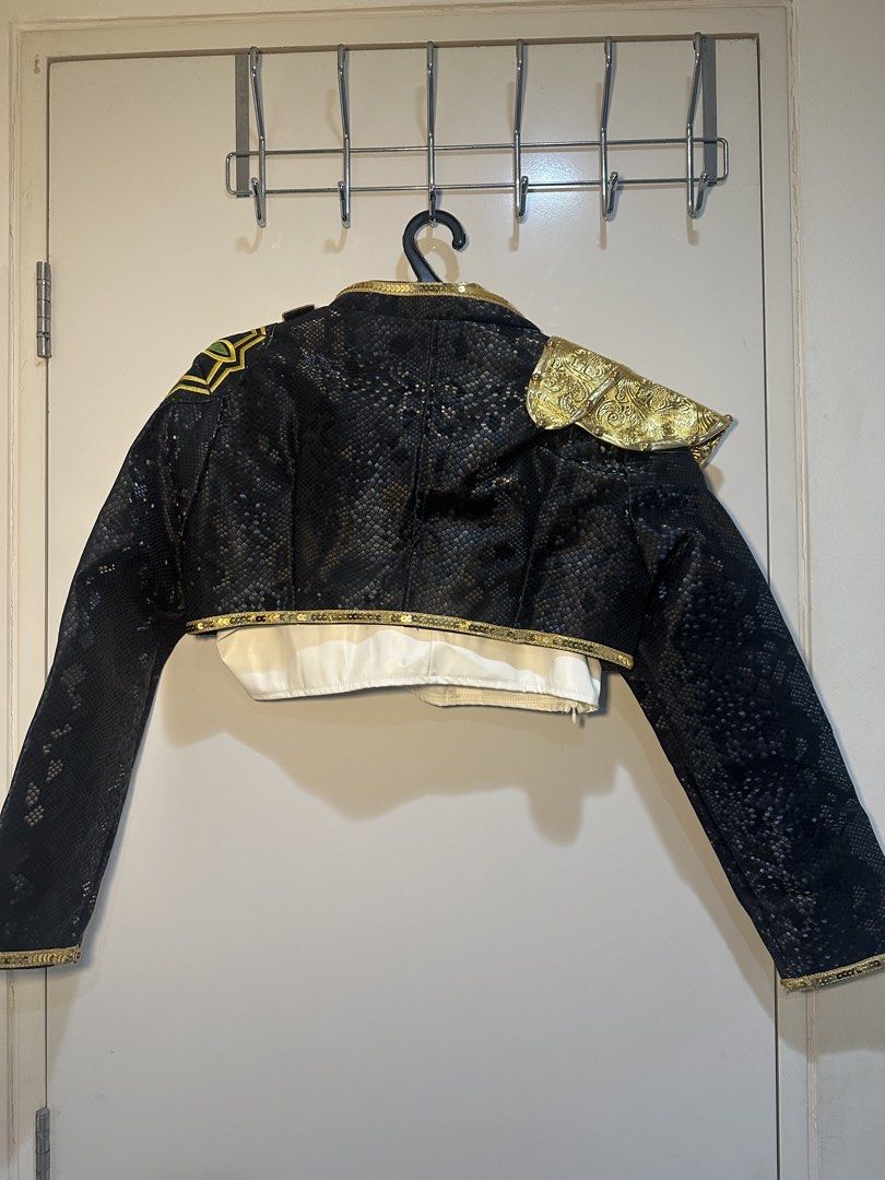 Rumi Jacket and Top Costume (Category: Coats, Jackets and Outerwear) located in Taguig. Submitted by ellajanee (Listing ID 1468786570, Image 2). Description: - Eye-catching black snakeskin texture short jacket with luxurious gold trim - Features an ornate gold shoulder epaulet with tassel details and metal chain accents - Designed with a smooth white satin inner layer and stylish front strap details - Back showcases a full textured pattern with a
