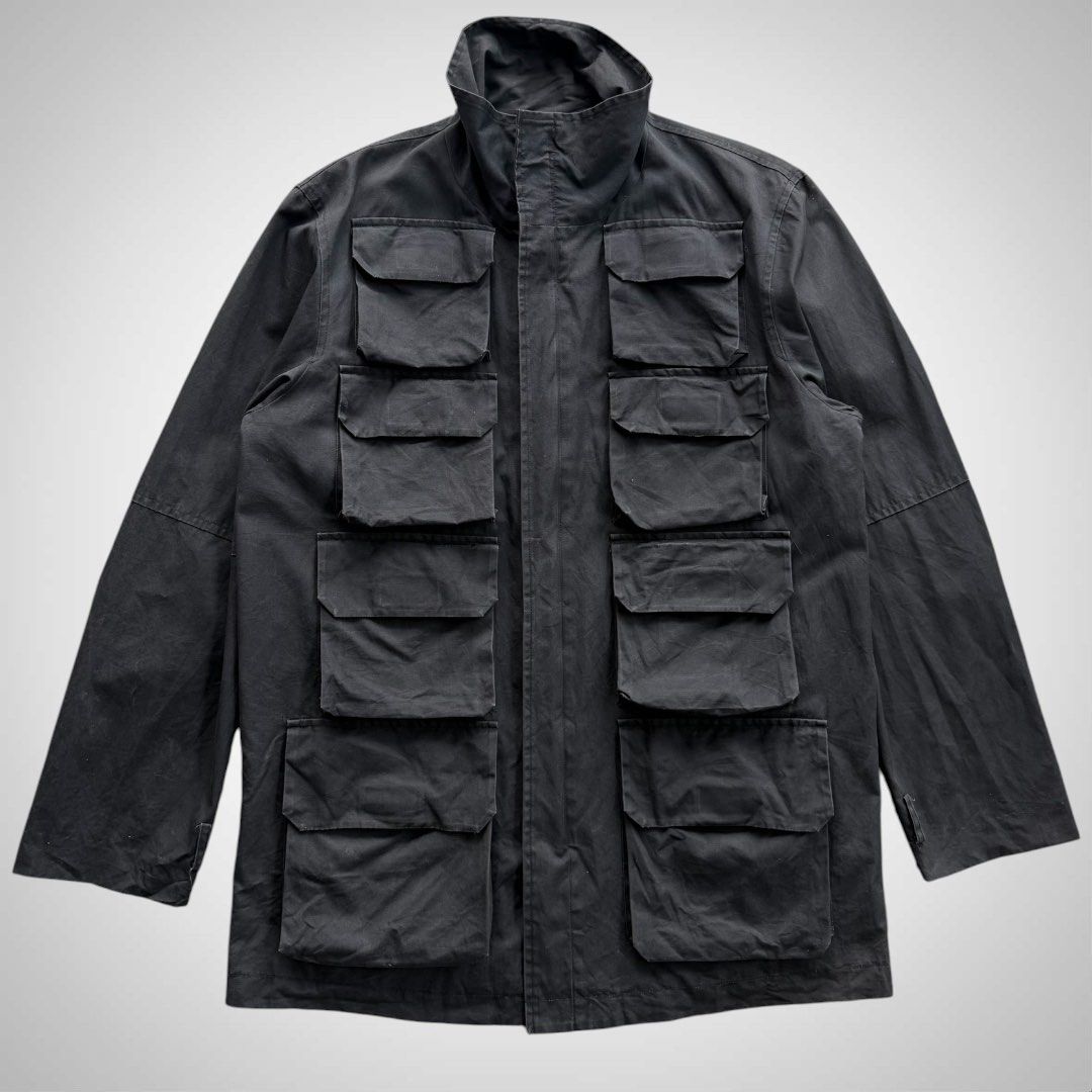 Ryuichiro Shimazaki Military Parasite Cargo Jacket (Category: Coats, Jackets and Outerwear) located in Zamboanga. Submitted by the.angura.store (Listing ID 1468722837, Image 1). Description: Ryuichiro Shimazaki Military Parasite Cargo Jacket 90’s Ryuichiro Shimazaki Parasite Field Cargo Jacket, features striking eight-pocket front grid with concealed front fastening, a high protective stand collar. 2-zipper closure that can be styled in multiple 