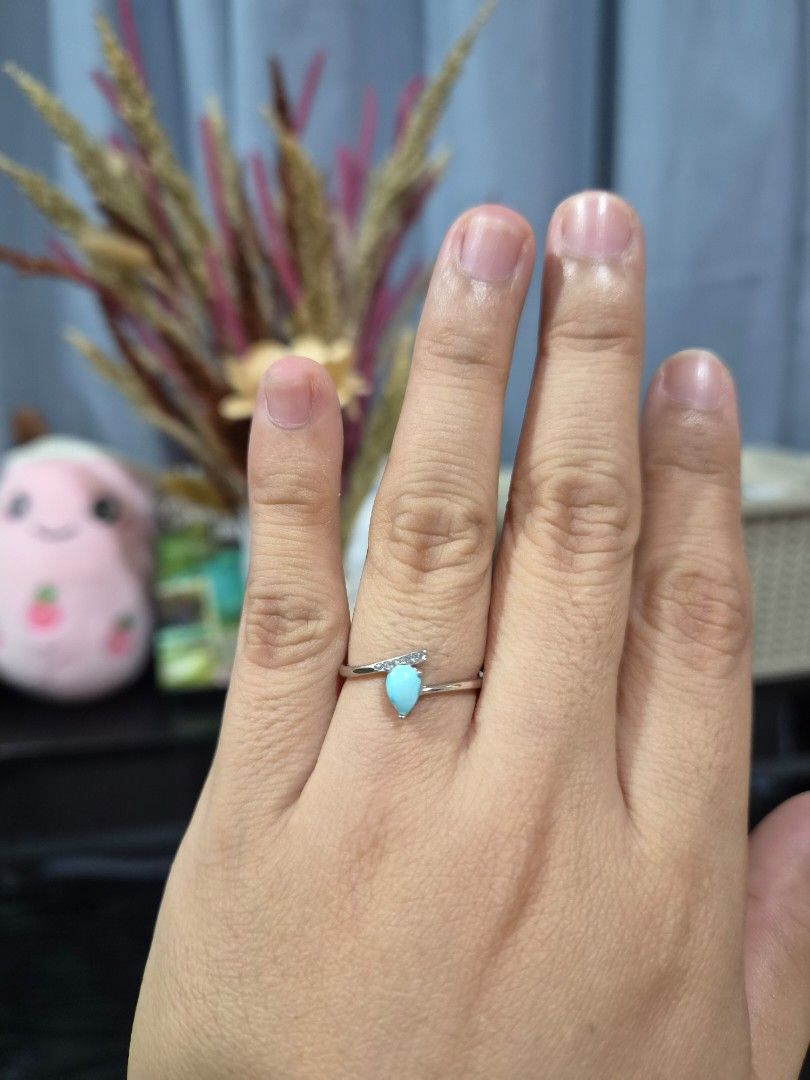S925 Silver Tear Drop Turquoise Stone Ring (Category: Rings) located in Manila. Submitted by fayiefar (Listing ID 1468830986, Image 3). Description: - Material: S925 Silver - Design: Teardrop turquoise stone with sparkling accent stones in a wrap-around band - Fit: adjustable and lightweight on the finger - Status: On hand and ready to ship - with certification card.