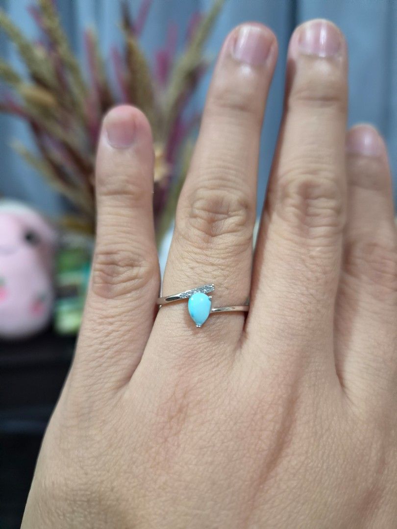 S925 Silver Tear Drop Turquoise Stone Ring (Category: Rings) located in Manila. Submitted by fayiefar (Listing ID 1468830986, Image 2). Description: - Material: S925 Silver - Design: Teardrop turquoise stone with sparkling accent stones in a wrap-around band - Fit: adjustable and lightweight on the finger - Status: On hand and ready to ship - with certification card.