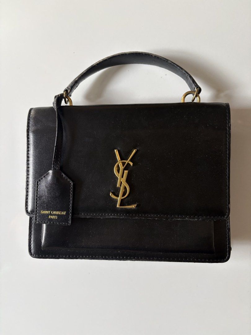 Saint Laurent Black Leather Monogram Satchel Bag (Category: Luxury Bags & Wallets) located in Manila. Submitted by gigiayls (Listing ID 1468779319, Image 1). Description: - Brand: Saint Laurent - Material: Premium black smooth leather - Hardware: Iconic gold YSL logo and interior gold brand stamping - Features: Top handle style, hanging leather tag stamped Saint Laurent Paris, magnetic flap closure, and multi-compartment interior - Condition: Goo