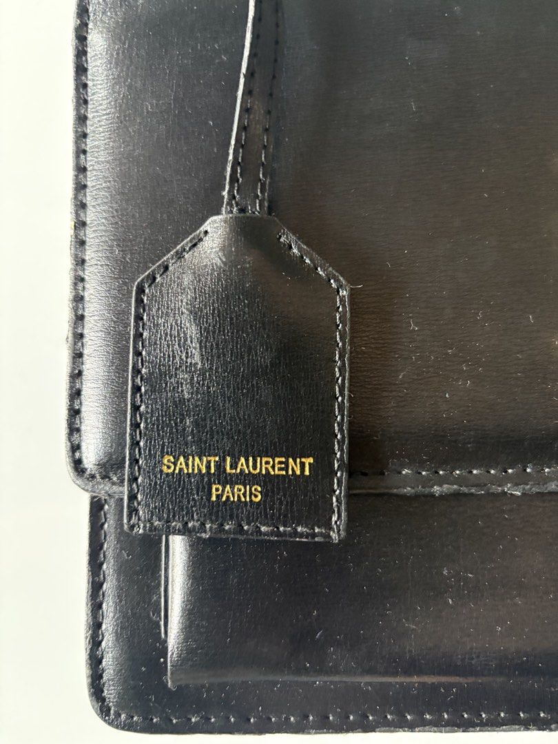 Saint Laurent Black Leather Monogram Satchel Bag (Category: Luxury Bags & Wallets) located in Manila. Submitted by gigiayls (Listing ID 1468779319, Image 2). Description: - Brand: Saint Laurent - Material: Premium black smooth leather - Hardware: Iconic gold YSL logo and interior gold brand stamping - Features: Top handle style, hanging leather tag stamped Saint Laurent Paris, magnetic flap closure, and multi-compartment interior - Condition: Goo