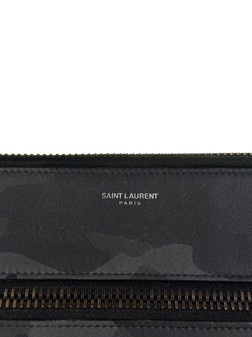 SAINT LAURENT Ride Camouflage Clutch (Category: Luxury Bags & Wallets) located in Manila. Submitted by luvluxe.mnl (Listing ID 1468775017, Image 2). Description: Medium to large size Perf for your documents Made of calfskin Can be unisex With minimal signs of use as seen on the pictures— but overall in very good condition Still presentable; no functionality issue Soo nice!! Rare find! Being sold on other resellers site online for 300$ or 18k+ php