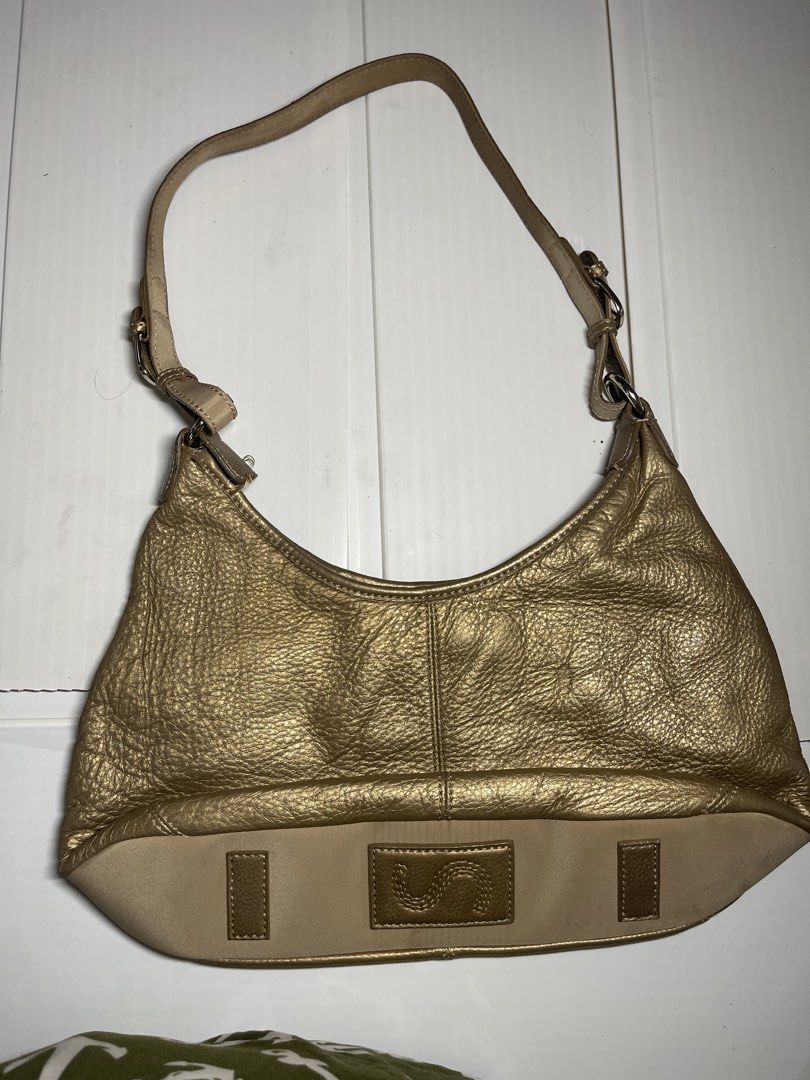 SAK gold leather handbag (Category: Shoulder Bags) located in Mandaluyong City. Submitted by coolmeybab (Listing ID 1468776120, Image 1). Description: Vintage SAK leather gold color bag Please manage expectations as it will need sewing in one of its strap base. MR Quickie can do it. Please check photos very well .