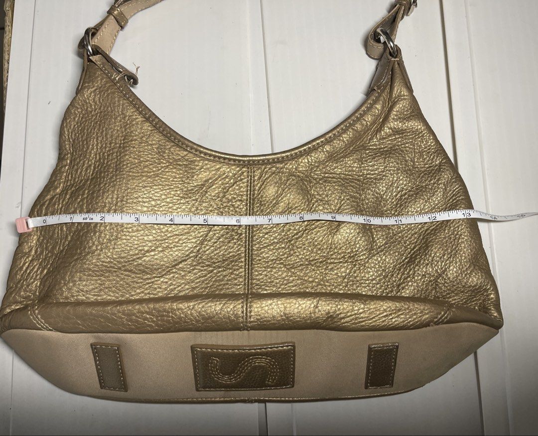 SAK gold leather handbag (Category: Shoulder Bags) located in Mandaluyong City. Submitted by coolmeybab (Listing ID 1468776120, Image 2). Description: Vintage SAK leather gold color bag Please manage expectations as it will need sewing in one of its strap base. MR Quickie can do it. Please check photos very well .