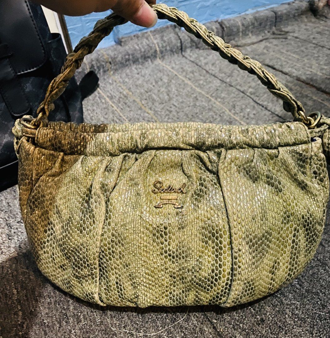 Salad Green Snakeskin Pattern Shoulder Bag Handbag (Category: Shoulder Bags) located in Baguio. Submitted by littlebitspicyy (Listing ID 1468718499, Image 1). Description: - Brand: Salad - Color/Texture: Green snakeskin texture - Hardware: Gold-tone with front metal brand logo plate - Design: Stylish braided handle and trendy gathered ruching along the top and sides - Size: Compact and lightweight, perfect grab-and-go bag for daily use and outing